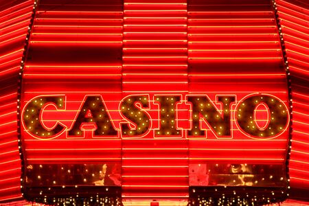 Casino entrance sign in red neon lightsの写真素材