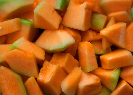 Cut pieces of Cantaloupe fruitの写真素材