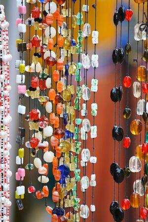 Colorful hanging beads at art fair in Indiaの写真素材
