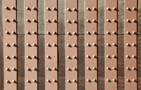 background of antique door with metal rivetsの写真素材