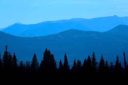 Rocky mountains caught in early morning fogの写真素材