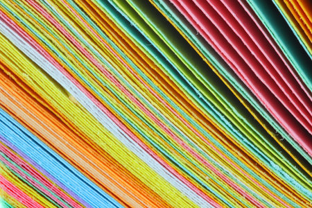 Close up shot of stack of colorful papers