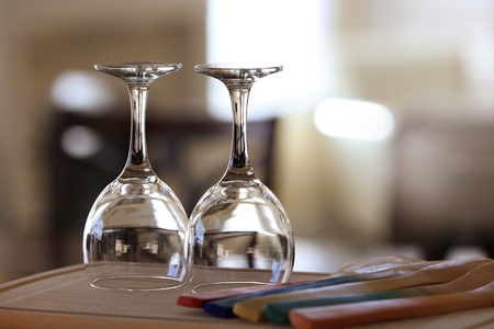 Two empty wine glasses on dining tableの写真素材