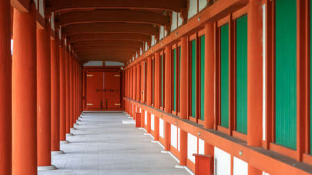 Tall red pillars and windows of historic Yakushi-ji temple in Nara, Japan.のeditorial素材