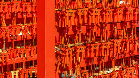 Kyoto, Japan - August 8, 2019. Many small red torii gates with prayers left by devotees at famous Fushimi Inari-Taisha Shinto Shrine in Kyoto, Japan,のeditorial素材