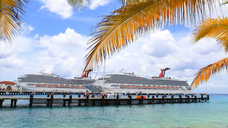 Cozumel,Mexicao-July 5,2017: Two Carnival cruise liners at Puerta Maya Pirs in Cozumel, Mexico. The economy of Cozumel is based on tourismのeditorial素材