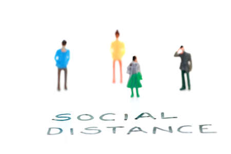 People figures placed at distance to show concept of social distancingの写真素材