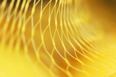 Close up shot of yellow nylon net with selective focus for background use