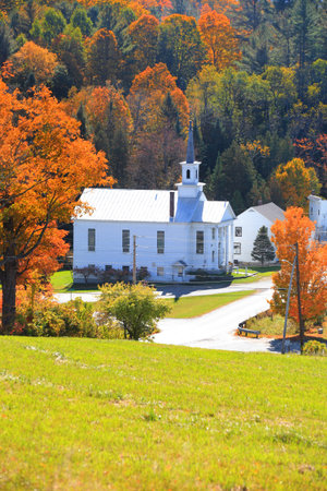 Historic church in West Barnet village in Vermont during autumn time