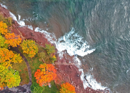 Aerial view of lake superior shore with autumn trees in Michigan upper peninsulaの写真素材