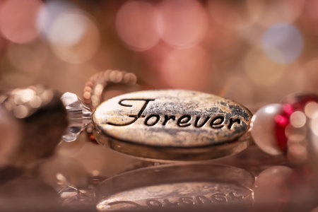 Close up shot old bracelet with "forever" text.の写真素材