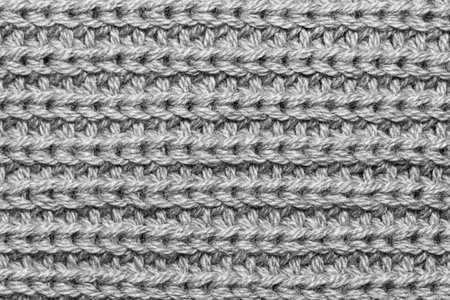 Close up shot of knitting on woolen fabric for background useの写真素材