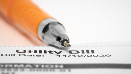 Close up shot of pen tip on utility billの写真素材