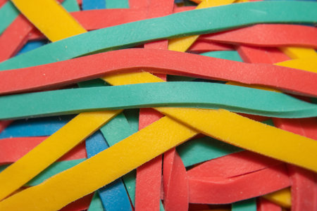 Close up shot of colorful rubber bands tangled together