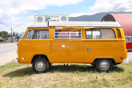 Kalispell , Montana, USA - 07-06-2010 : yellow VW bus type 2 vintage campervan. The concept for the Type 2 is credited to Dutch Volkswagen importer Ben Pon.のeditorial素材