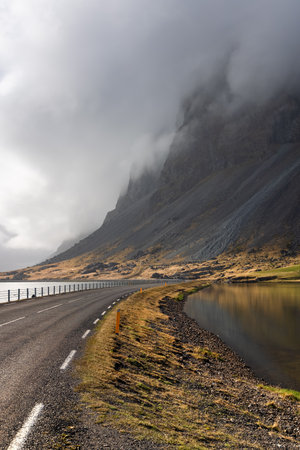 Dark cloud cover on mountains in Iceland eastern shore lineの写真素材