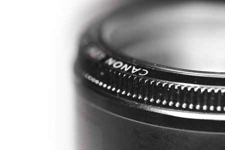 South Lyon, Michigan, USA - 01 December 2022: Old Canon 50mm prime DSLR camera lens. Canon Inc. is a Japanese multinational corporation specialized in manufacturing high quality camera lenses.のeditorial素材