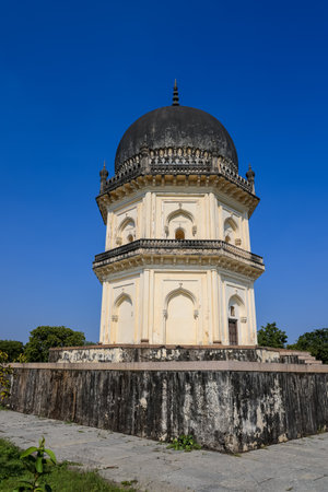 Historic tomb in Hyderabad, India against blue sky.の写真素材