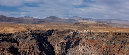 Panoramic view of rock formations due to erosion in Death valley national park.の写真素材