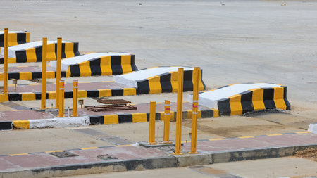 Road dividers painted yellow and black at a newly constructed toll booth in rural India.の写真素材