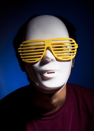 Men in white mask and yellow glassesの写真素材
