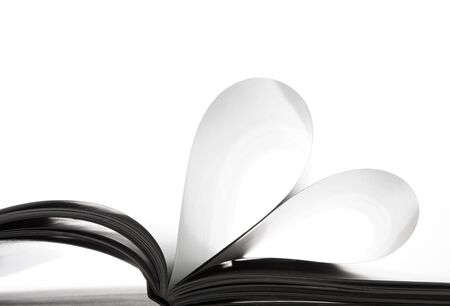 Pages in the book bent in the form of heartの写真素材