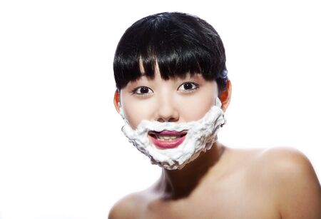 Portrait of the Asian girl, the person is covered by a skin for shavingの写真素材