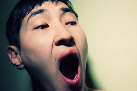 Obverse portrait of the shouting scared man, emotionの写真素材