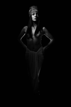 The girl the European in a suit of the Egyptian on a black backgroundの写真素材