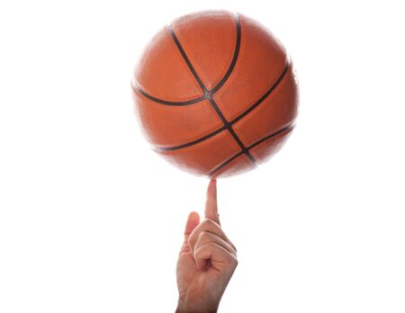 The isolated image of a hand and basketball ball on a white backgroundの写真素材