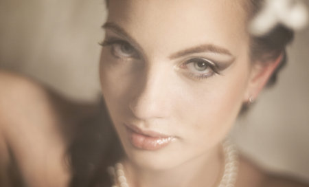 Portrait of the beautiful girl of the bride with soft light