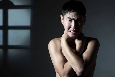 The guy tries to strangle two hands itselfの写真素材