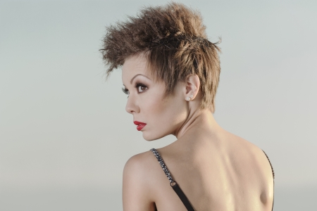 Attractive girl model posing at sunsetの写真素材