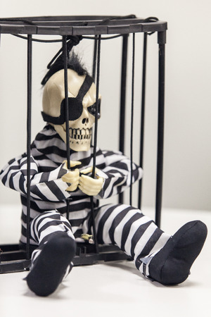 Skeleton toy in a prisonの写真素材