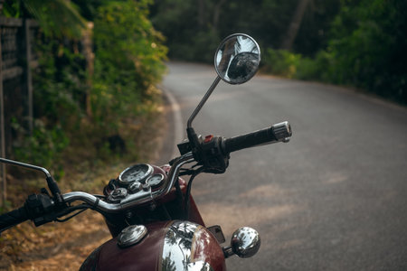 Motorcycle parked by the road in the Indian village
