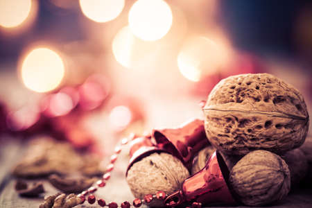 Walnuts on an old wooden table. Christmas background.の写真素材