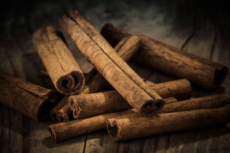 cinnamon on old wooden table from closeの写真素材