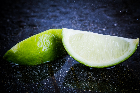 lime on a black marble desk closelyの写真素材