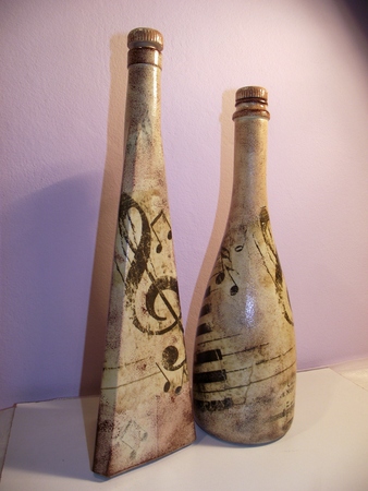 Bottles to whom it is done with decoupage musical detail.の写真素材
