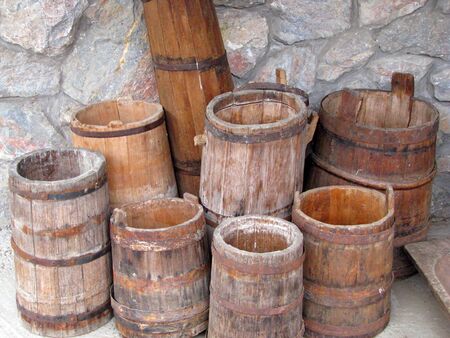 Old wooden barrels displayed in ethno-villageの写真素材