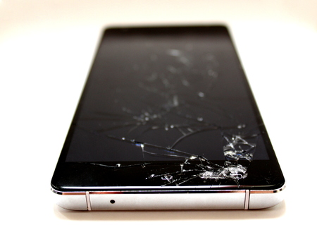a broken cell phoneの写真素材