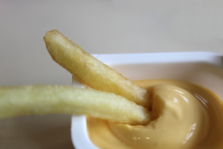 crispy french fries in cheese sauce liesの写真素材