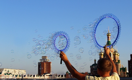 many small soap bubbles create a personの写真素材