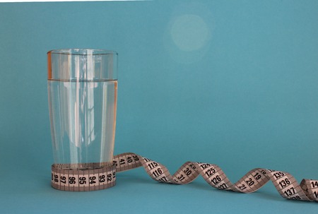 a glass of water with a centimeterの写真素材