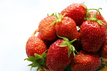 small basket of delicious juicy ripe strawberriesの写真素材