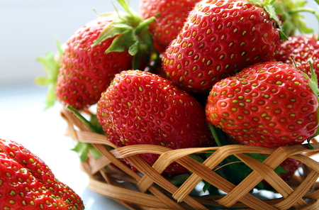 small basket of delicious juicy ripe strawberriesの写真素材