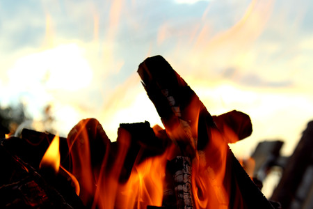 In the evening a fire is burning with an open flameの写真素材