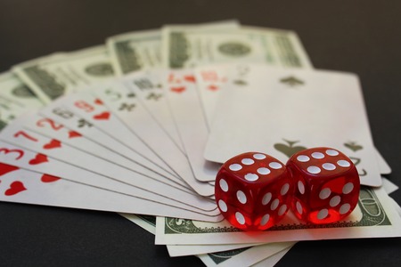 cube cards cubes and money lie on the tableの写真素材