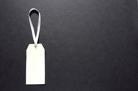 paper label for clothes on a black backgroundの写真素材