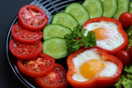 easy breakfast fried egg and fresh vegetablesの写真素材